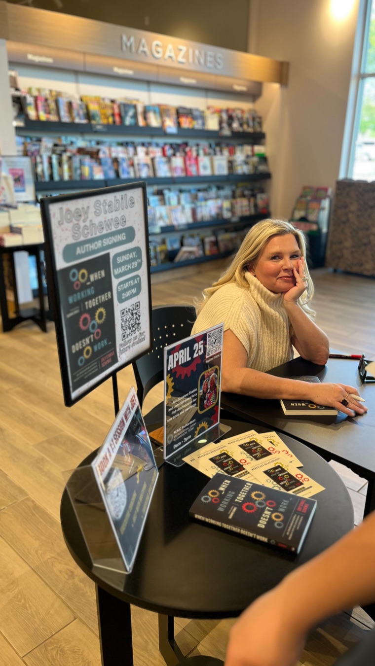 Joey at a book signing for When Working Together Doesn’t Work